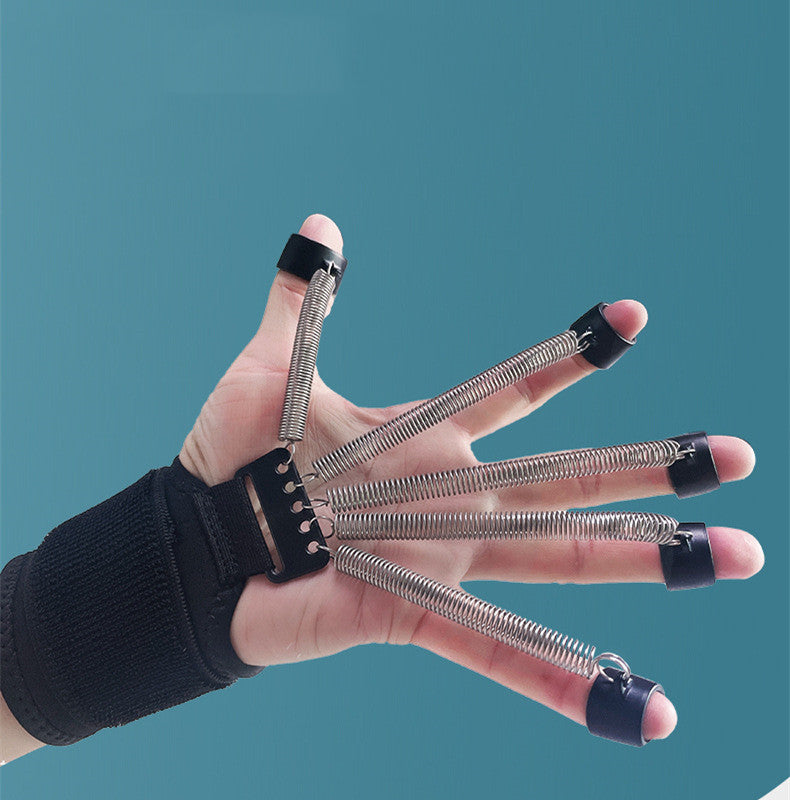 Black wrist support with metal spring finger loops for hand exercise, worn on a hand against a blue background.
