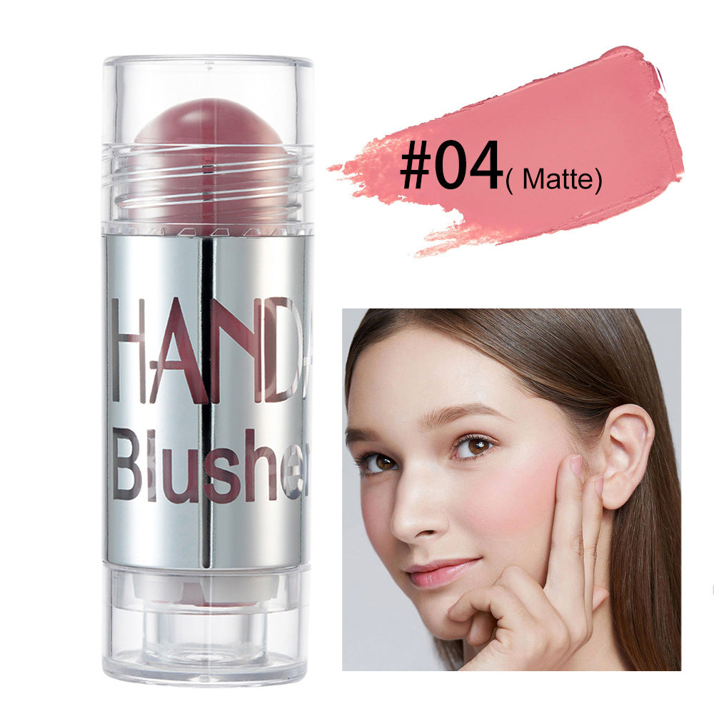 Digitaldistribution375 #04 Matte pink cream blush stick with clear cap and model showing application on cheek.