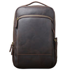 Dark brown leather backpack with a vintage finish, brass zippers, and a sturdy top handle against a white background.
