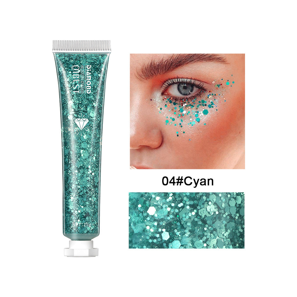 Cyan glitter face and body gel in a squeeze tube, shown applied under the eye on a model's face.