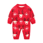 Red knitted newborn romper featuring reindeer and snowflake patterns with side-button closure for easy dressing.