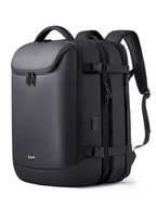 Black, minimalist vacuum compression backpack with side compression straps, top handle, and durable matte finish.