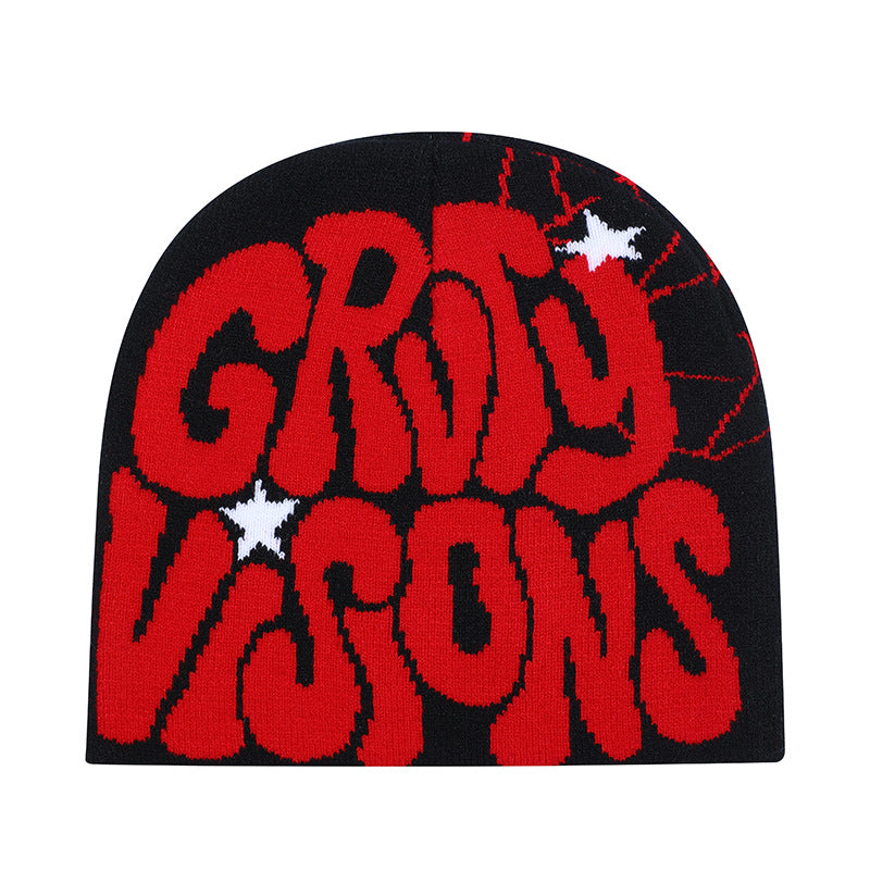 Black knit beanie with red "GRITY VISONS" text, spiderweb detail, and white star accents in a hip-hop style.