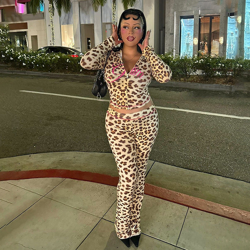 A model wears a beige and brown leopard print zip-up jacket and matching high-waisted tight trousers with pink piping.