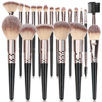 Digitaldistribution375 set of black-handled makeup brushes with rose gold ferrules and soft, dual-toned bristles.
