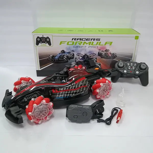 Red and black Formula drift RC car with spray feature, remote, gesture sensor, charging cable, and box on white surface.