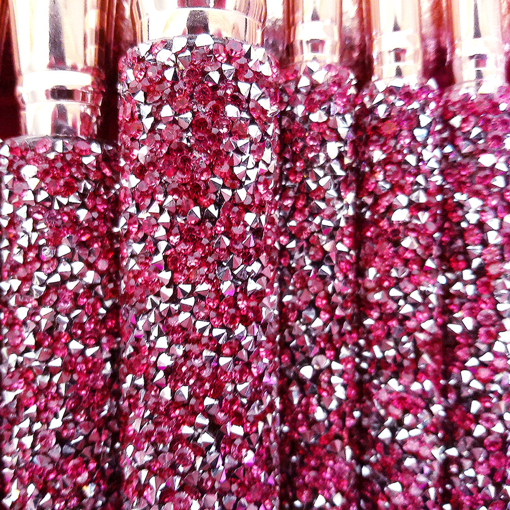 Digitaldistribution375 makeup brushes with sparkly, handmade crimson diamond-inlaid handles and metallic gold ferrules.