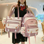 Pink and white Korean-style nylon backpack and matching tote, featuring cute animal charms and XUANTU brand patches.