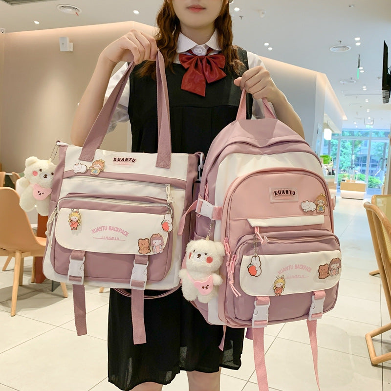 Pink and white Korean-style nylon backpack and matching tote, featuring cute animal charms and XUANTU brand patches.