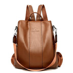 Brown soft leather women's backpack with adjustable straps and embossed logo on a minimalist, large-capacity design.