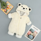 Cream-colored plush bear onesie for babies with a hooded animal face, zip front, and white cuffs on a gray background.
