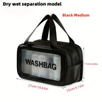 Medium black travel makeup bag with a clear front panel, "WASHBAG" text, carry handles, and side mesh pocket.