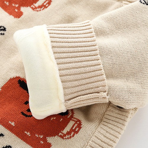 Beige knitted newborn baby onesie with rust-colored bear pattern, featuring a thick, soft white plush fleece lining.