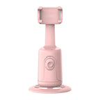 A pink, plastic 360-degree auto-tracking smartphone gimbal with a circular base, lens sensor, and adjustable cradle.