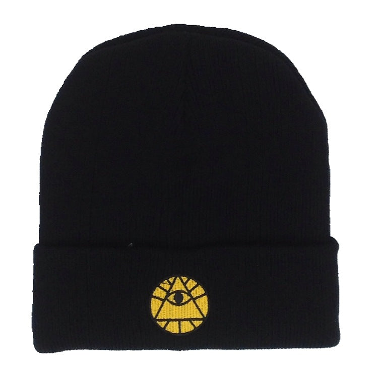 Black ribbed knit winter beanie featuring a yellow embroidered Eye of Providence symbol on the folded cuff.