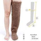 Brown fuzzy fleece over-the-knee socks on a leg, with a size chart diagram showing dimensions.
