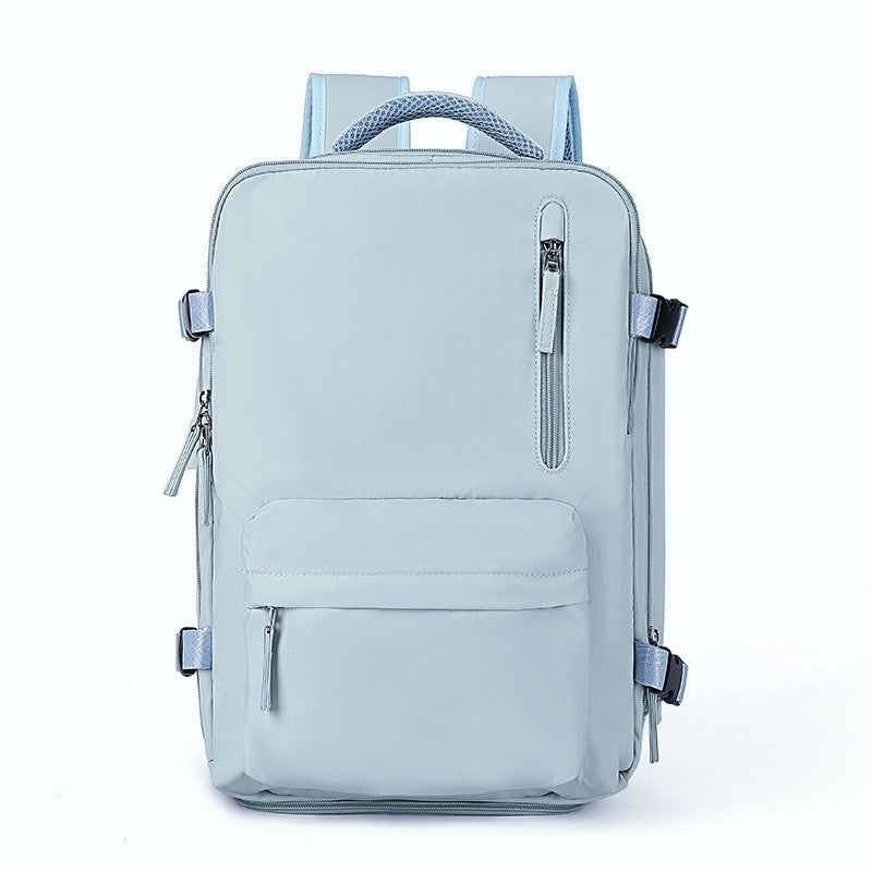 Light blue waterproof travel backpack with multiple zippered pockets, adjustable side straps, and padded mesh handle.