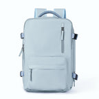 Light blue waterproof travel backpack with multiple zippered pockets, adjustable side straps, and padded mesh handle.