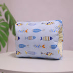Light blue cotton nursing arm pillow featuring a colorful fish pattern and soft, textured inner lining.