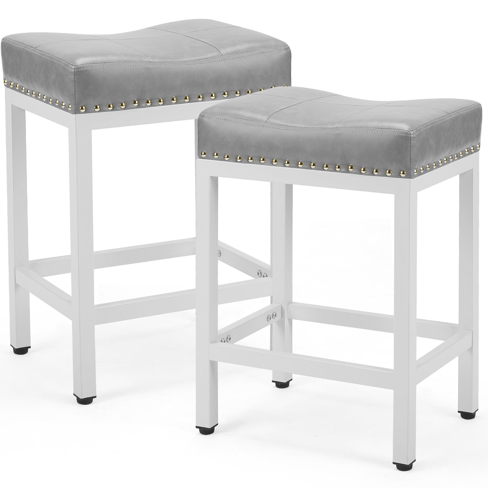 Two grey upholstered saddle bar stools with white steel frames and decorative gold nailhead trim.