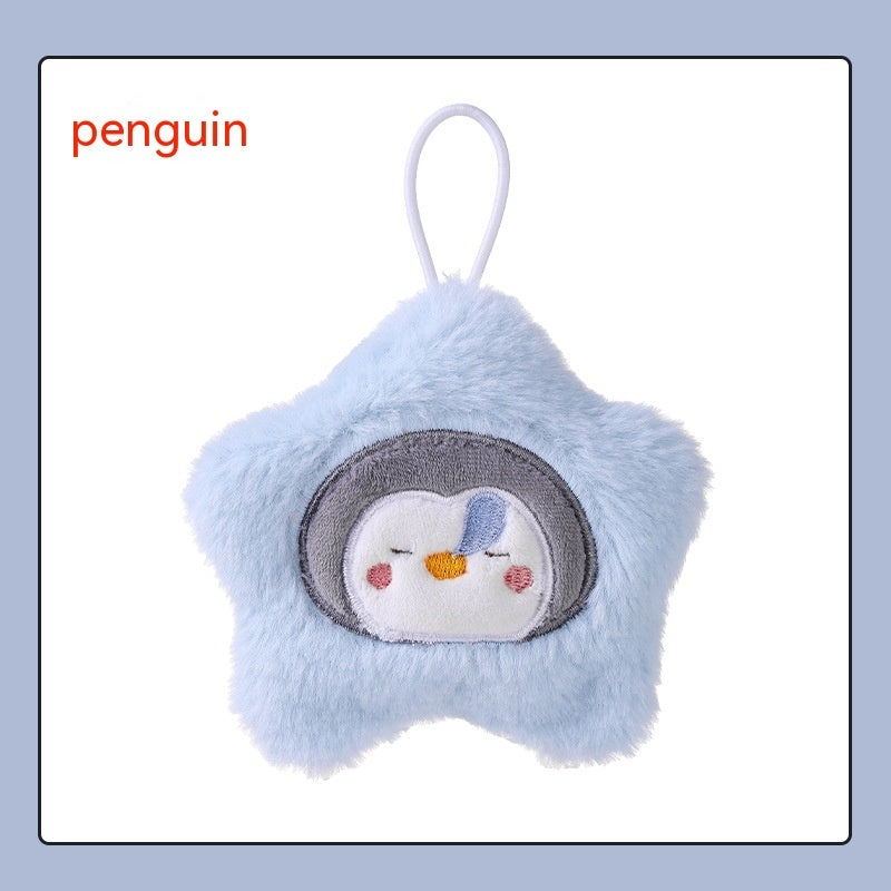Light blue plush star-shaped hand warmer with an embroidered sleepy penguin face and a white hanging loop.