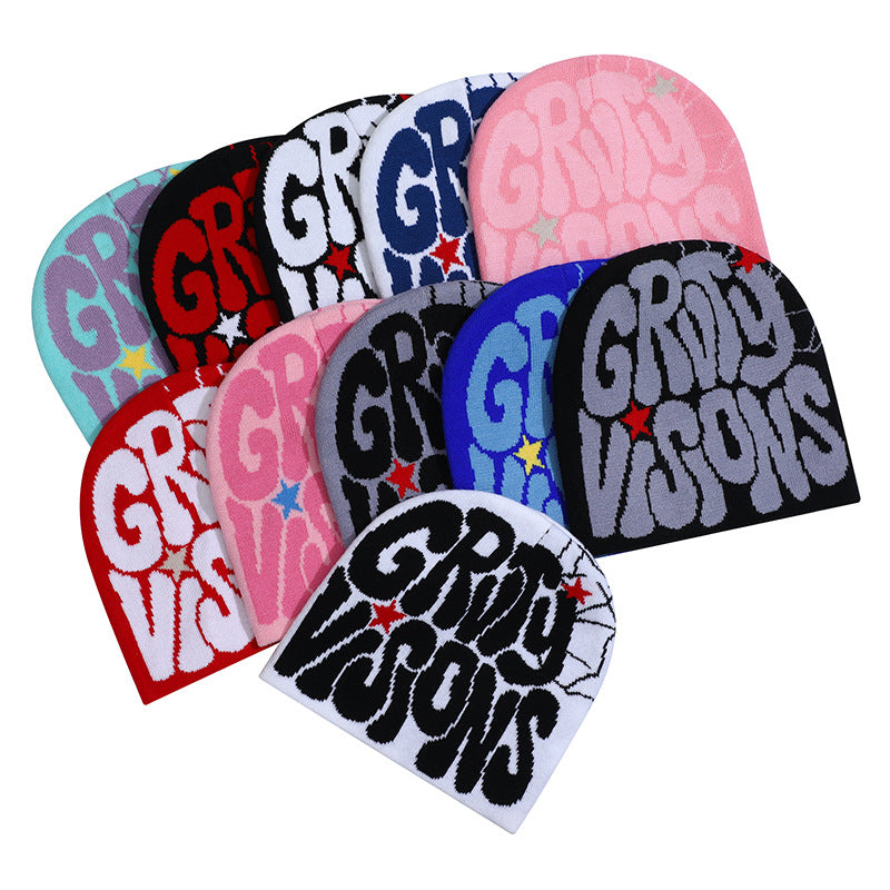 Assorted knit hip-hop beanies in various colors, each featuring a large graphic text logo and small star accents.