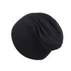 A simple, plain black newborn beanie cap made of soft, stretchable fabric with a slightly slouchy fit.