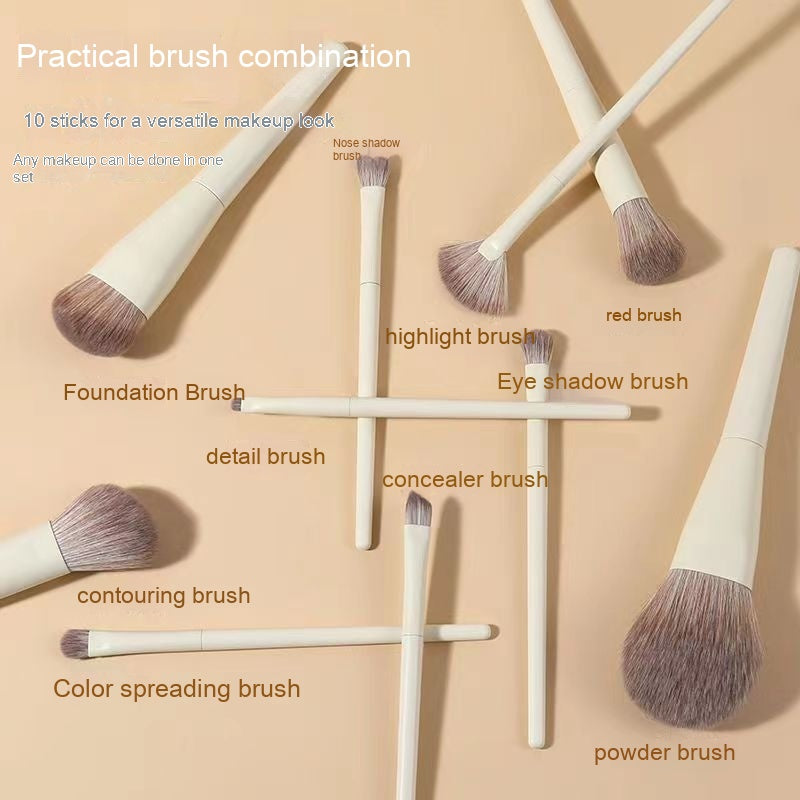 Set of 10 beige makeup brushes with soft, two-toned synthetic bristles, arranged on a matching beige background.