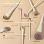 Set of 10 beige makeup brushes with soft, two-toned synthetic bristles, arranged on a matching beige background.