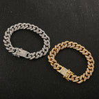 Two crystal-studded hip-hop cuban link bracelets in silver and gold tone on a black glitter background.