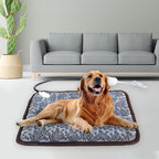 Golden retriever lying on a gray, floral-patterned, waterproof pet heating pad with a chew-resistant cord.
