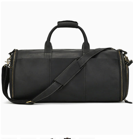 Black vintage leather duffle bag with side zippers, dual top handles, and a shoulder strap.