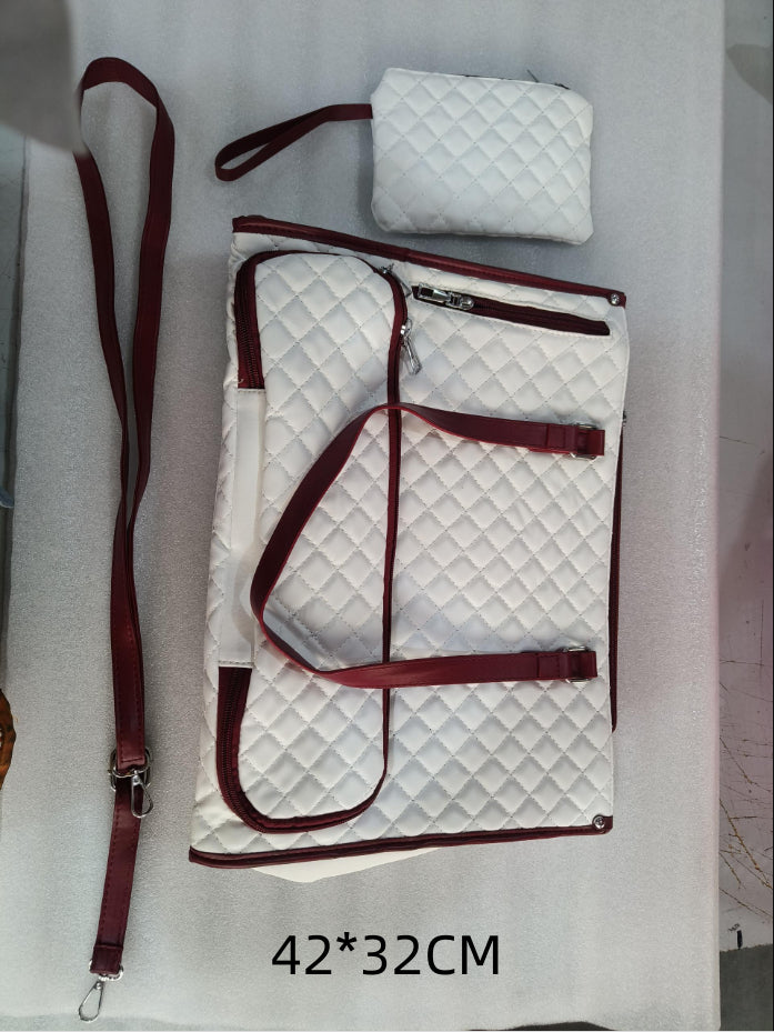 White quilted lunch tote with maroon trim, matching crossbody strap, and small purse. Large 42x32cm insulated bag.
