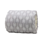 Grey cotton baby nursing arm pillow with a white arrow pattern and soft cream-colored lining.