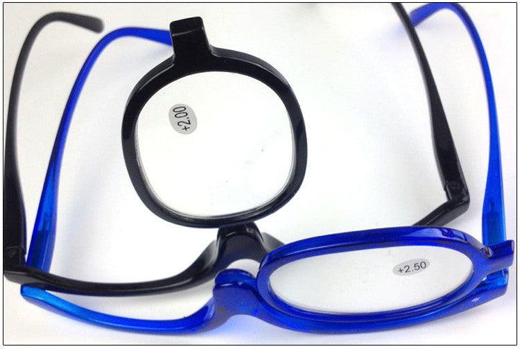 Digitaldistribution375 makeup reading glasses with blue and black frames and a flip-up lens feature.