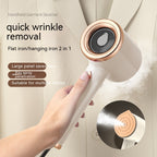 Handheld beige and rose gold garment steamer spraying steam, shown in hand against a light jacket. Inset shows nozzle.