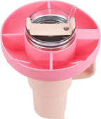 Pink 4-compartment silicone snack tray fitted onto a tumbler with a straw, providing convenient on-the-go storage.