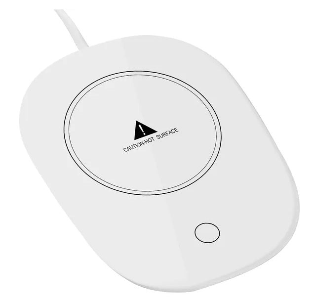 White, sleek electric mug warmer with a circular heating plate, safety warning, and power button on a glossy surface.