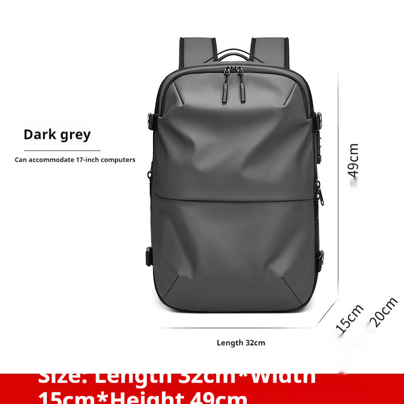 Minimalist dark grey travel backpack with a smooth, durable finish, dual zippers, and space for a 17-inch laptop.