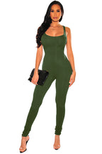 A woman wears a sleeveless, form-fitting olive green casual exercise jumpsuit in a soft, stretchy fabric.