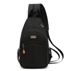 Black canvas sling backpack with orange accents, multiple zippered pockets, mesh side pocket, and built-in USB port.