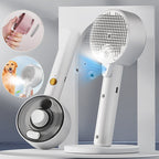 White steam pet grooming brush with metal bristles, gold button, and water tank. Includes insets showing usage on dog.