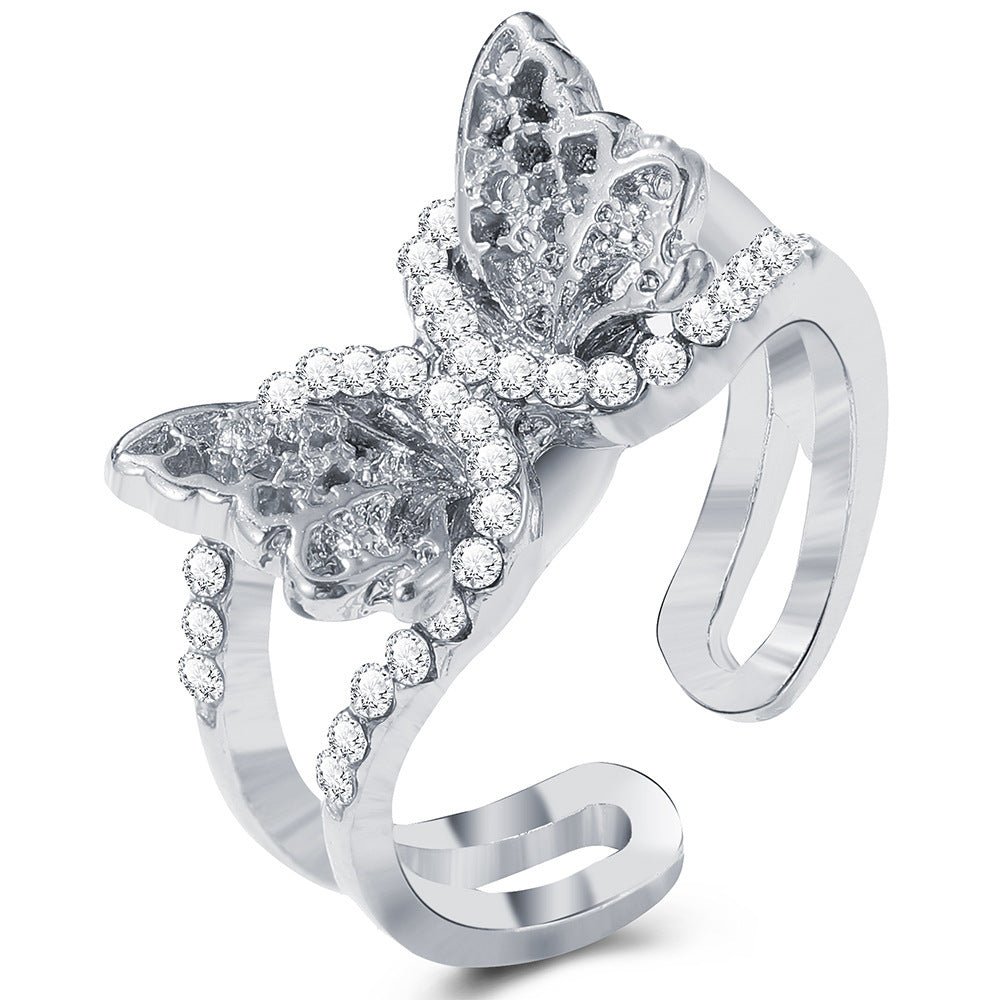 Silver-tone hip-hop style open ring featuring a butterfly motif adorned with shimmering clear crystals.
