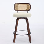 Swivel counter stool with walnut wood frame, beige upholstered seat, and a decorative woven cane backrest.