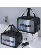 Two black, water-resistant travel toiletry bags with clear windows and "WASHBAG" text, featuring sturdy handles.
