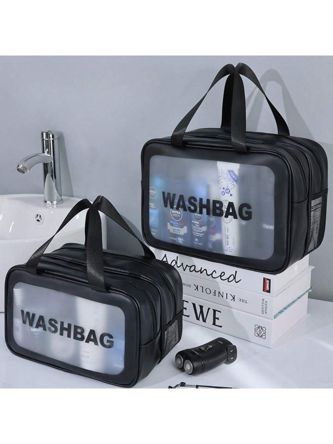 Two black, water-resistant travel toiletry bags with clear windows and "WASHBAG" text, featuring sturdy handles.
