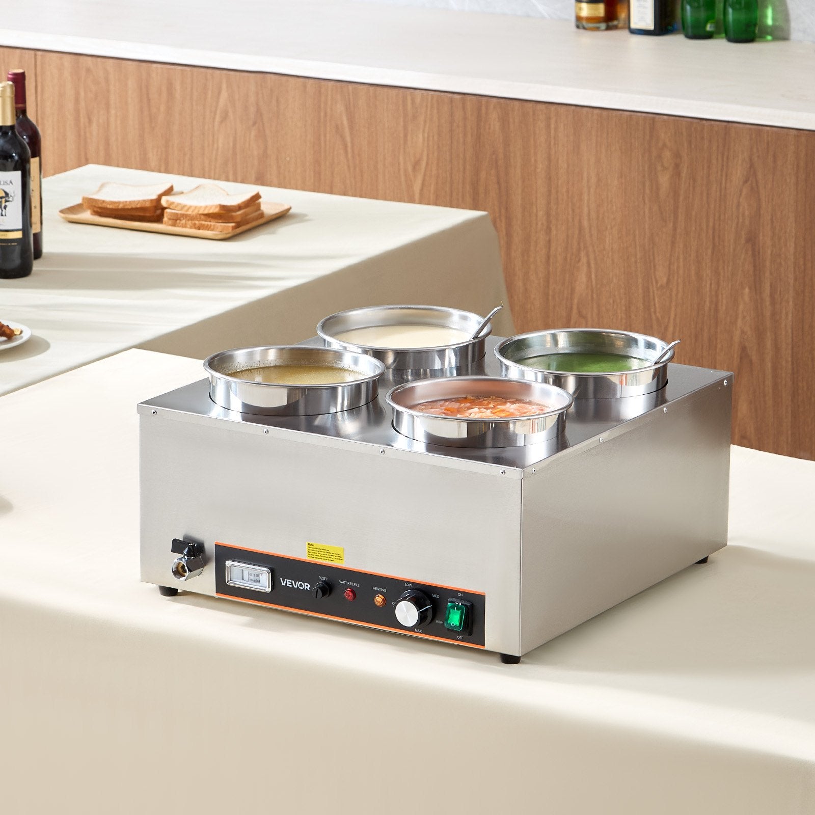 Stainless steel commercial soup warmer with 4 pots, control panel, drain valve, and heating indicator lights.