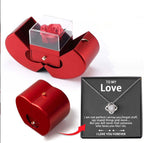Red apple-shaped gift box containing an eternal rose and a heart-shaped drawer, plus a "To My Love" necklace set.