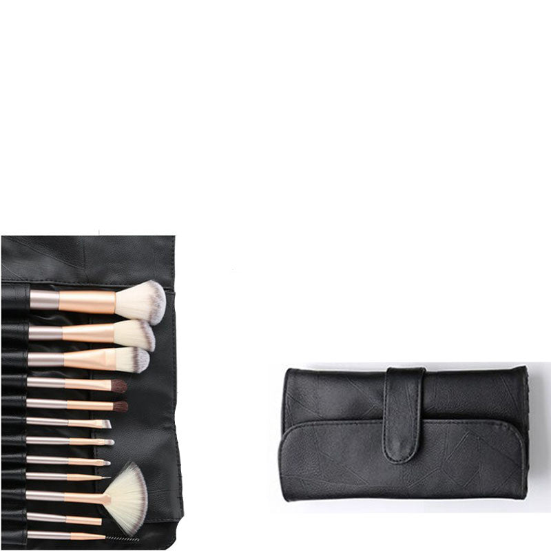 A 12-piece makeup brush set with synthetic white bristles and champagne handles in a black textured roll-up case.