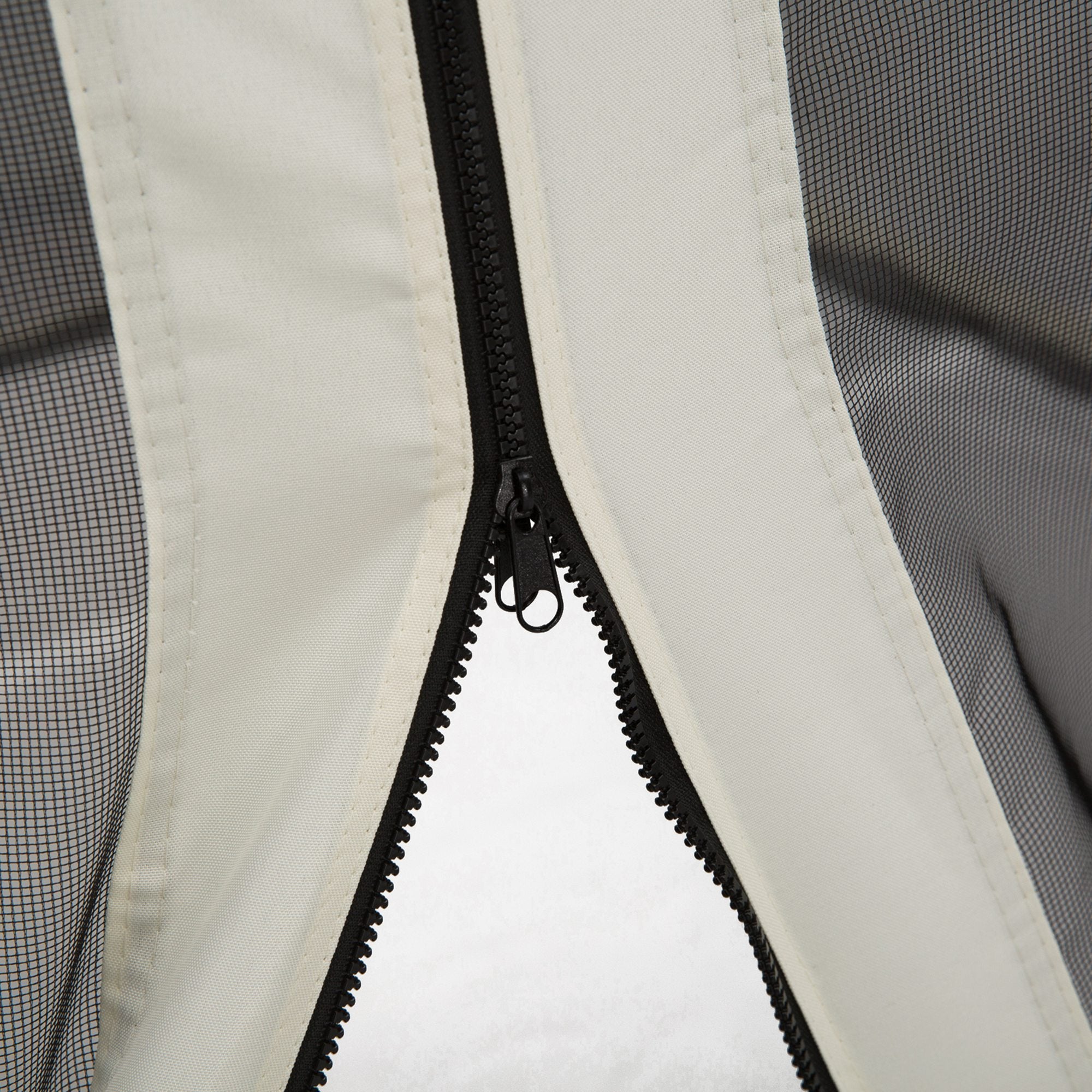 Close-up of black polyester gazebo mosquito netting featuring a sturdy center zipper and beige fabric trim.